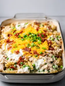 Delicious Crack Chicken Casserole topped with cheese and herbs
